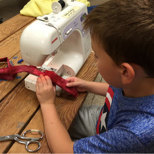 Picture of child sewing